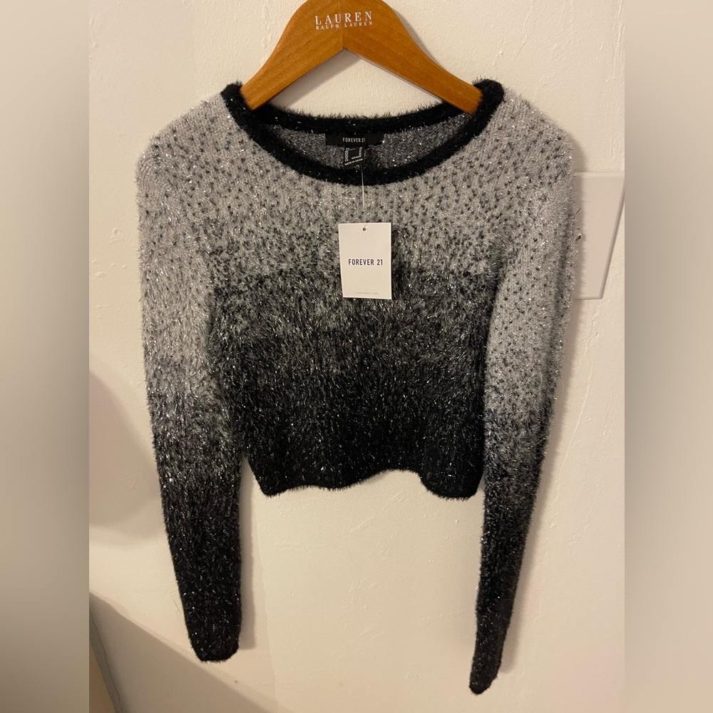 Beautiful and classy and elegant party sweater, with shimmer. New with tags